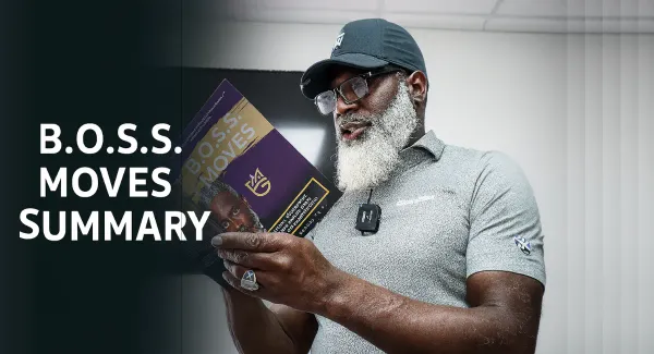 Myron Golden, wearing glasses, holds up a book titled "B.O.S.S. Moves" and looks at it. The text "B.O.S.S. MOVES SUMMARY" is visible on the left side of the image.