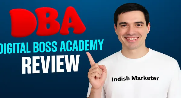 A man in a white t-shirt with "Indish Marketer" written on it smiles and points, with the words "DBA," "DIGITAL BOSS ACADEMY," and "REVIEW" on a blue background.